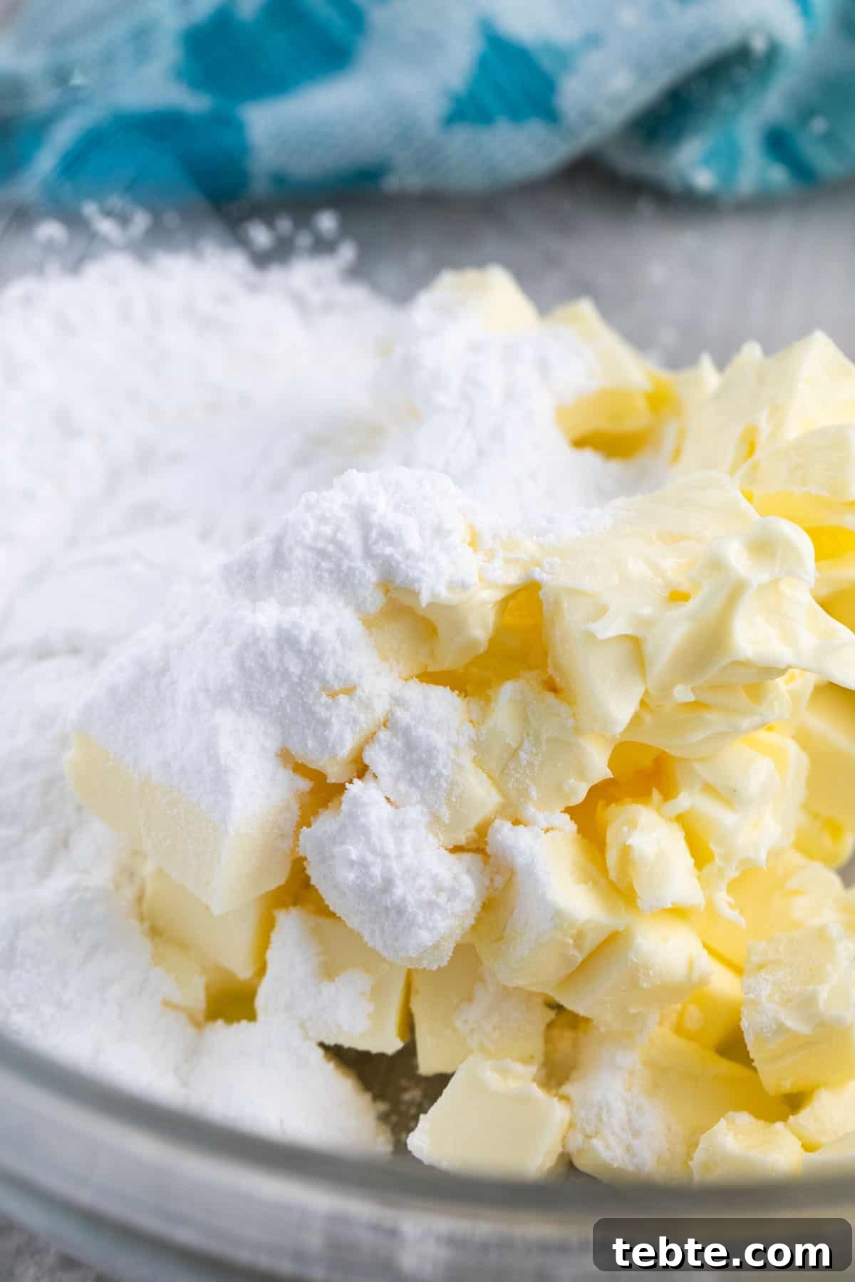 butter and powdered sugar in a bowl.