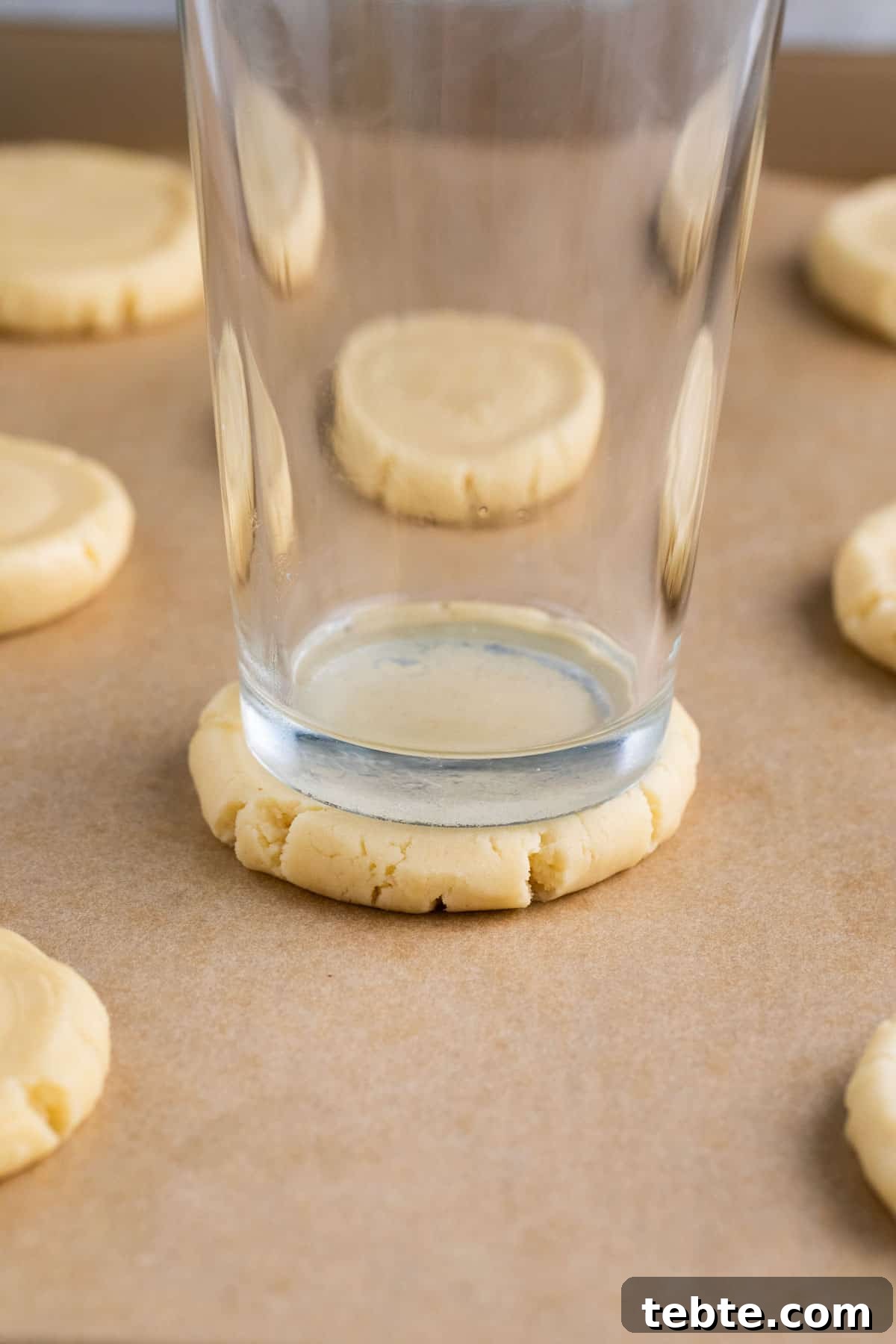 shortbread cookies smashed with a glass on a cookies sheet.