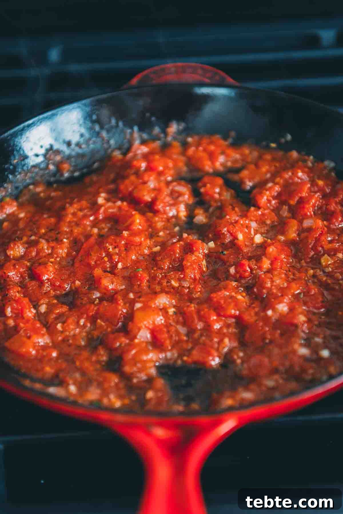 Crispy Halloumi Shrimp Saganaki with Tomato and Feta 6 Diced tomatoes in a skillet.