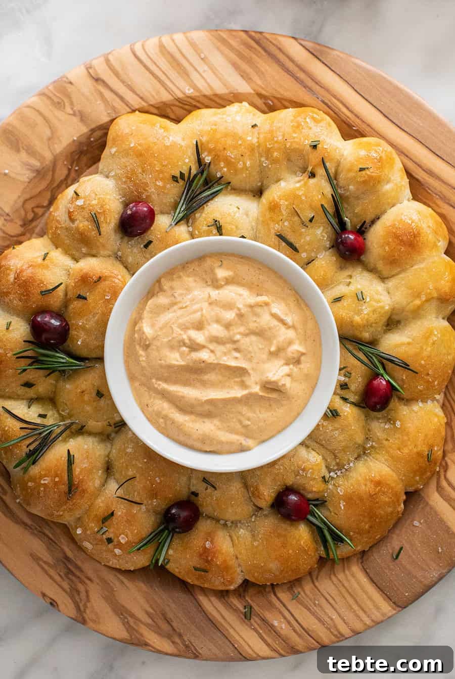 Christmas bread wreath with cheese dip.