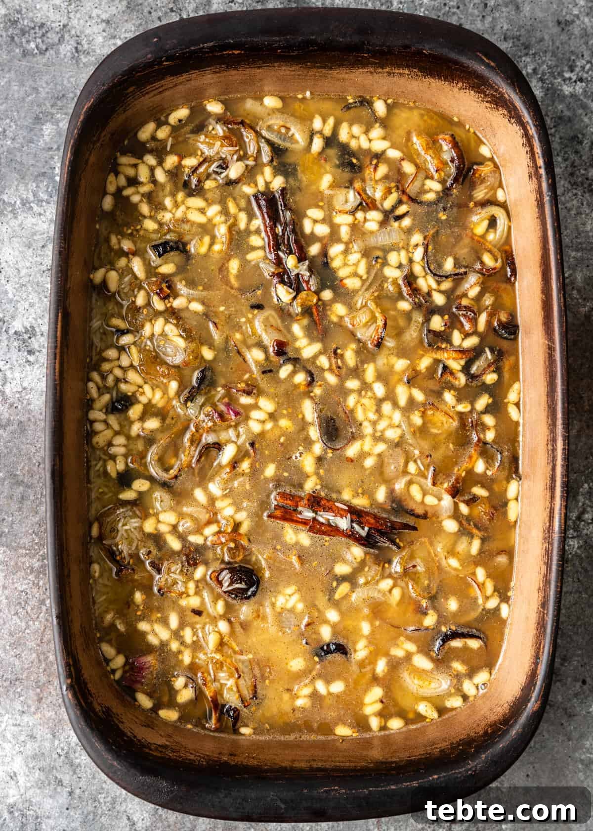 Authentic Middle Eastern Rice Pilaf Recipe with Aromatic Spices 8 overhead: baking dish of basmati rice pilaf with zaatar spices