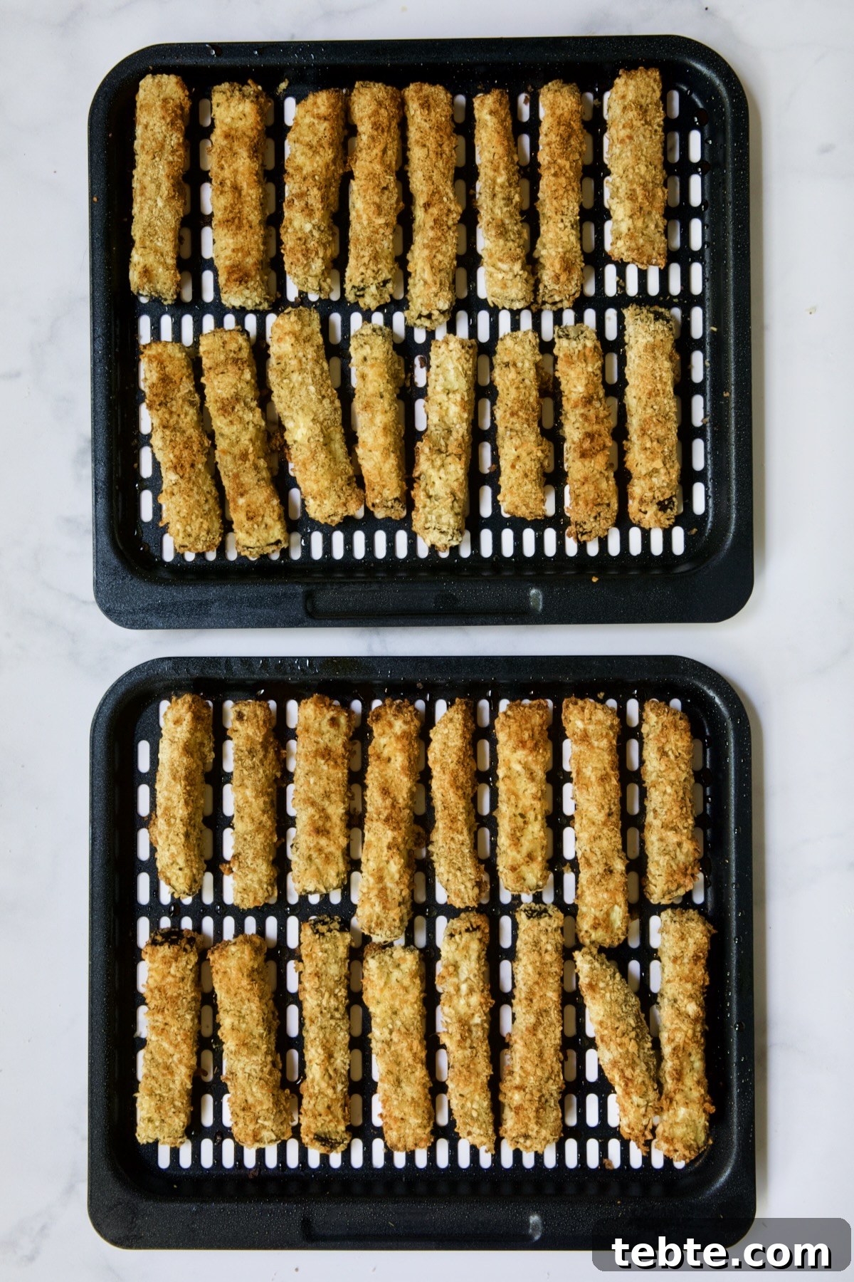 Crispy Air Fryer Eggplant Fries with Garlic Parmesan Dip 15 Two trays of finished eggplant fries.
