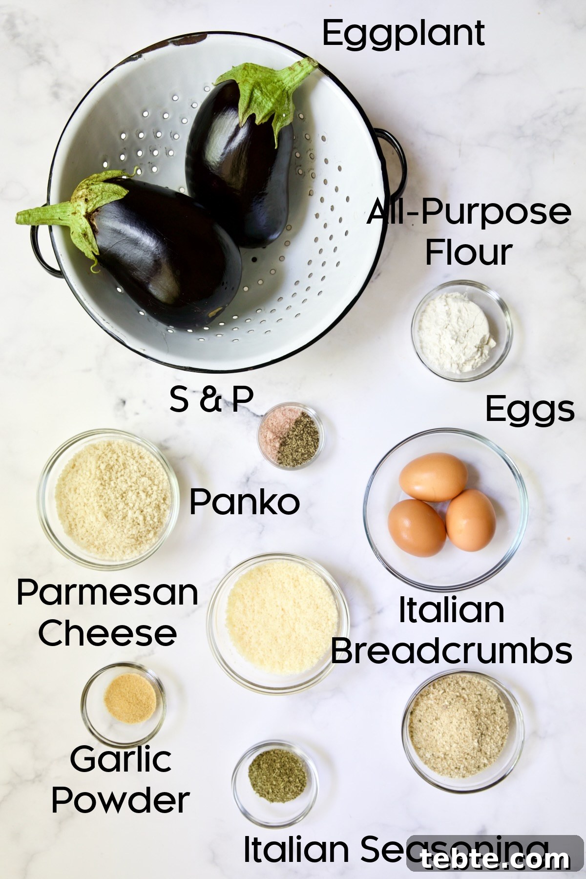 Crispy Air Fryer Eggplant Fries with Garlic Parmesan Dip 4 Ingredients for Air Fryer Eggplant Fries on white marble background.