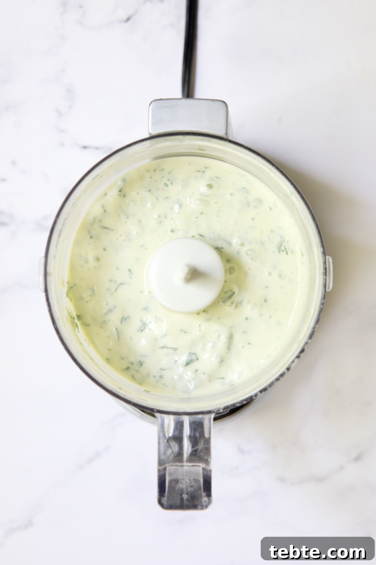 Crispy Air Fryer Eggplant Fries with Garlic Parmesan Dip 8 Garlic Basil Aioli in mini food processor.
