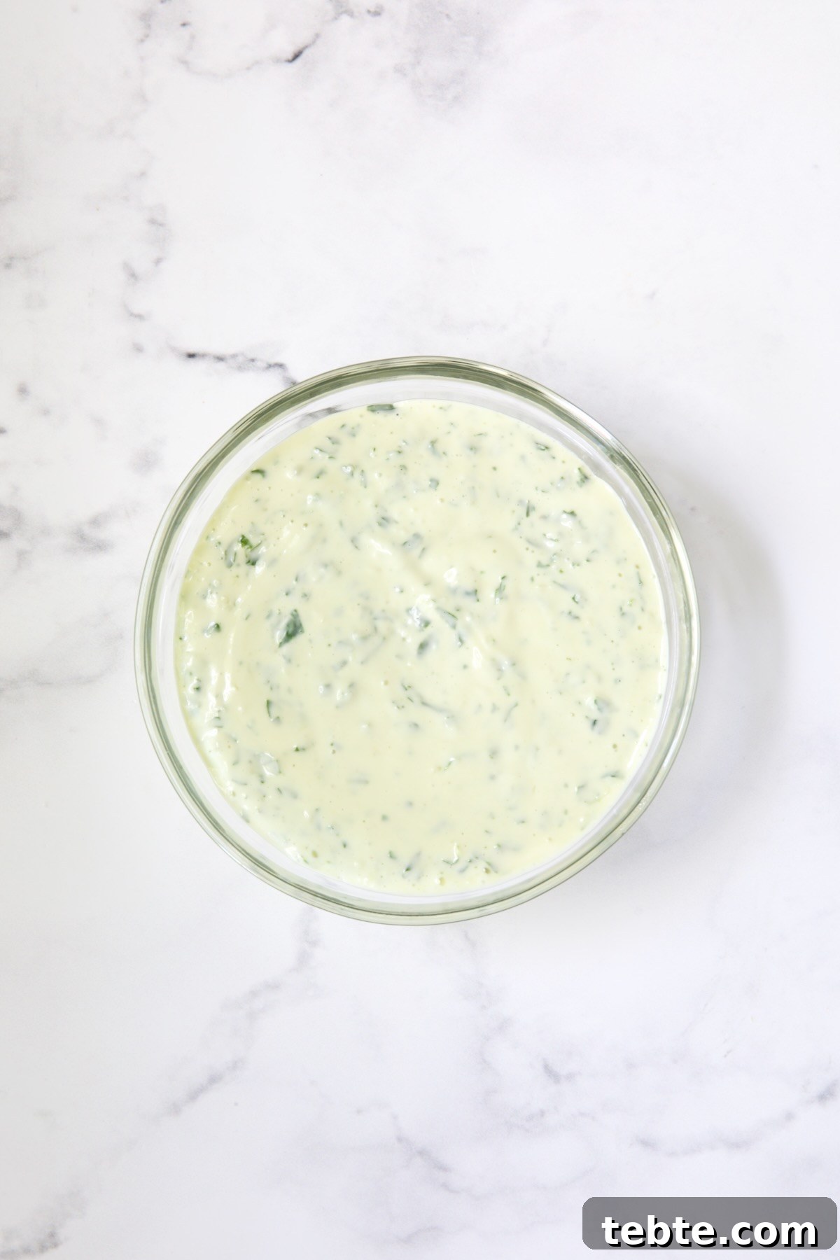 Crispy Air Fryer Eggplant Fries with Garlic Parmesan Dip 9 Bowl of Garlic Basil Aioli on marble surface.