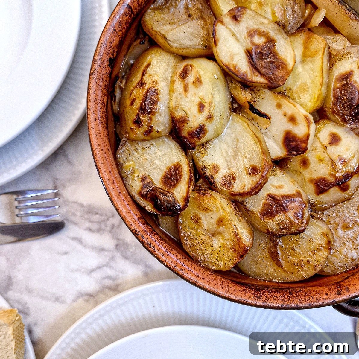 Close up of the browned potato topping on the oven-baked lamb potjie.