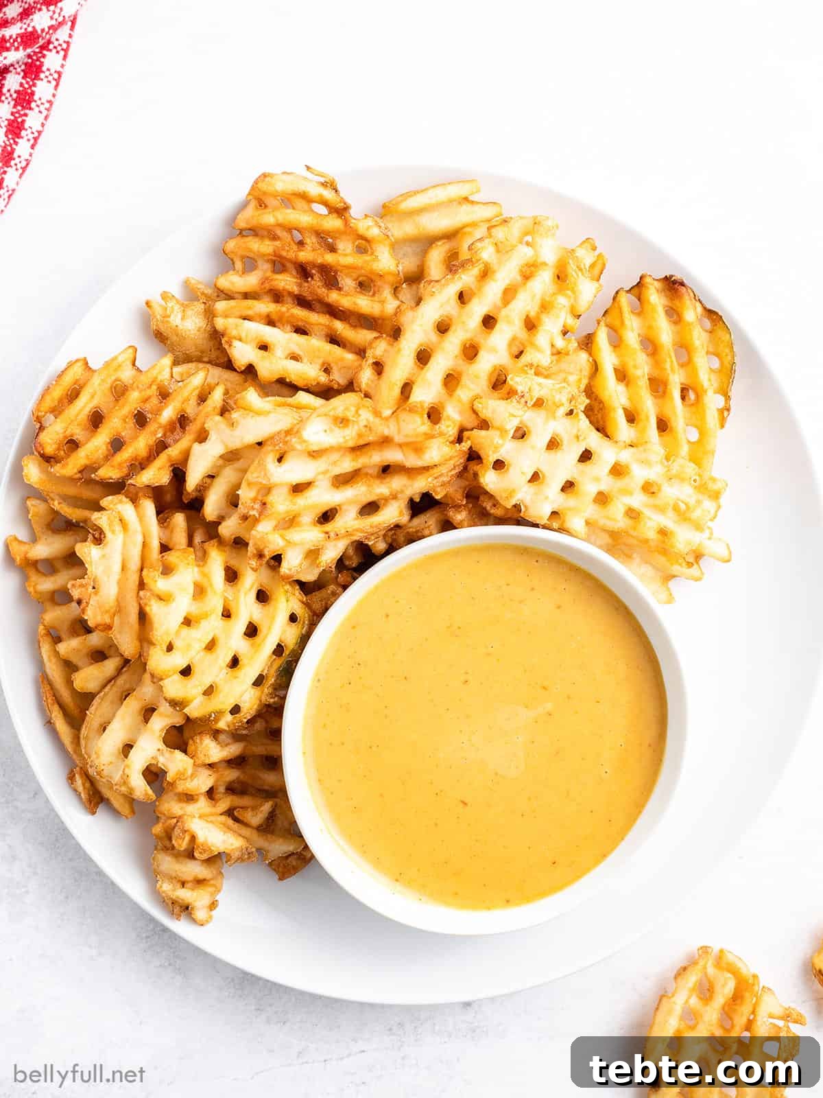Copycat Chick-fil-A Sauce Recipe: Homemade Dipping Sauce Guide 2 Overhead view of chick-fil-a sauce on a plate with waffle fries