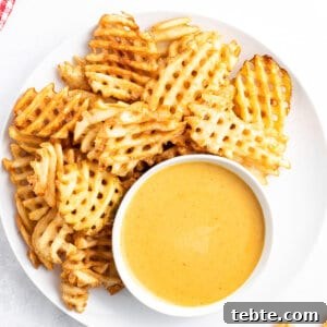 Copycat Chick-fil-A Sauce Recipe: Homemade Dipping Sauce Guide 3 Overhead view of chick-fil-a sauce on a plate with waffle fries