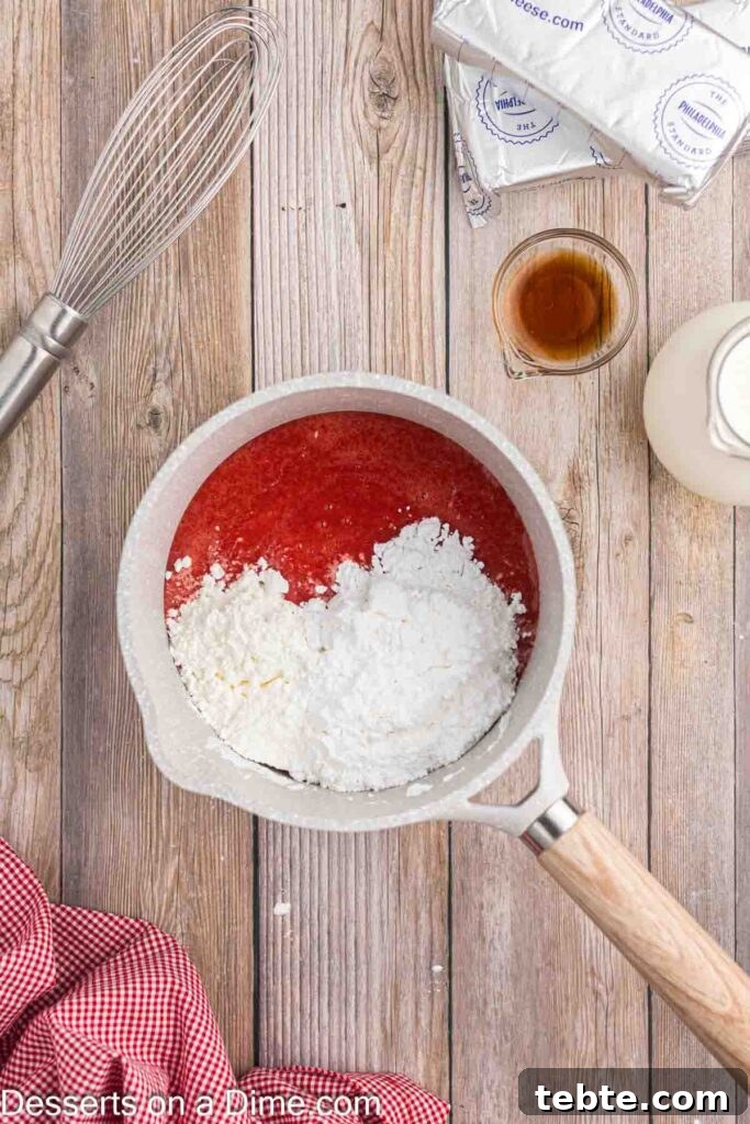 Creamy No-Bake Strawberry Cheesecake Recipe 6 Pureed strawberries in a saucepan with powdered sugar and cornstarch
