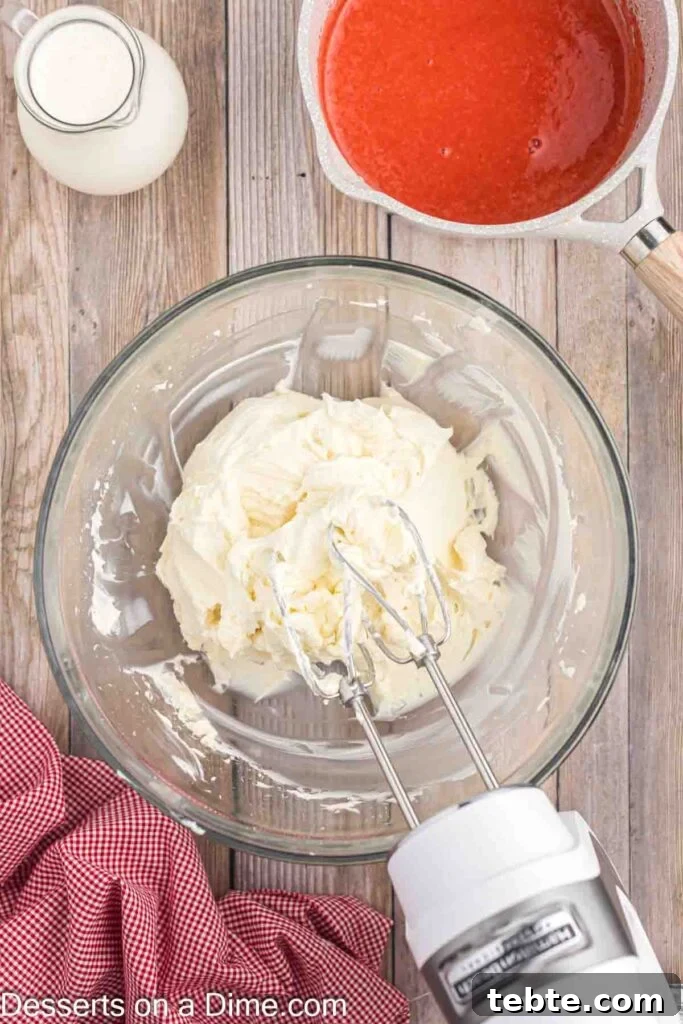 Creamy No-Bake Strawberry Cheesecake Recipe 7 Beating cream cheese, powdered sugar, and vanilla, then adding heavy cream