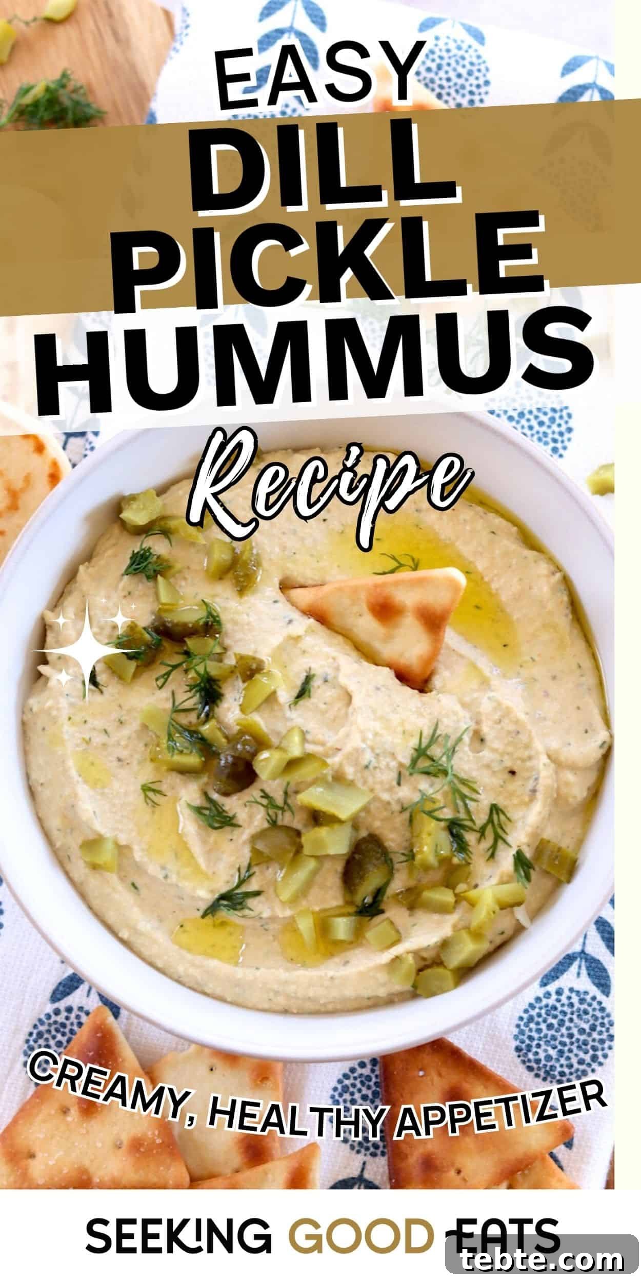 Dill Pickle Hummus: Tangy Chickpea Spread Recipe That Pops 4 A bowl of dill pickle hummus topped with chopped pickles, dill, and olive oil, served with pita chips. Creamy hummus flavored with dill pickles.