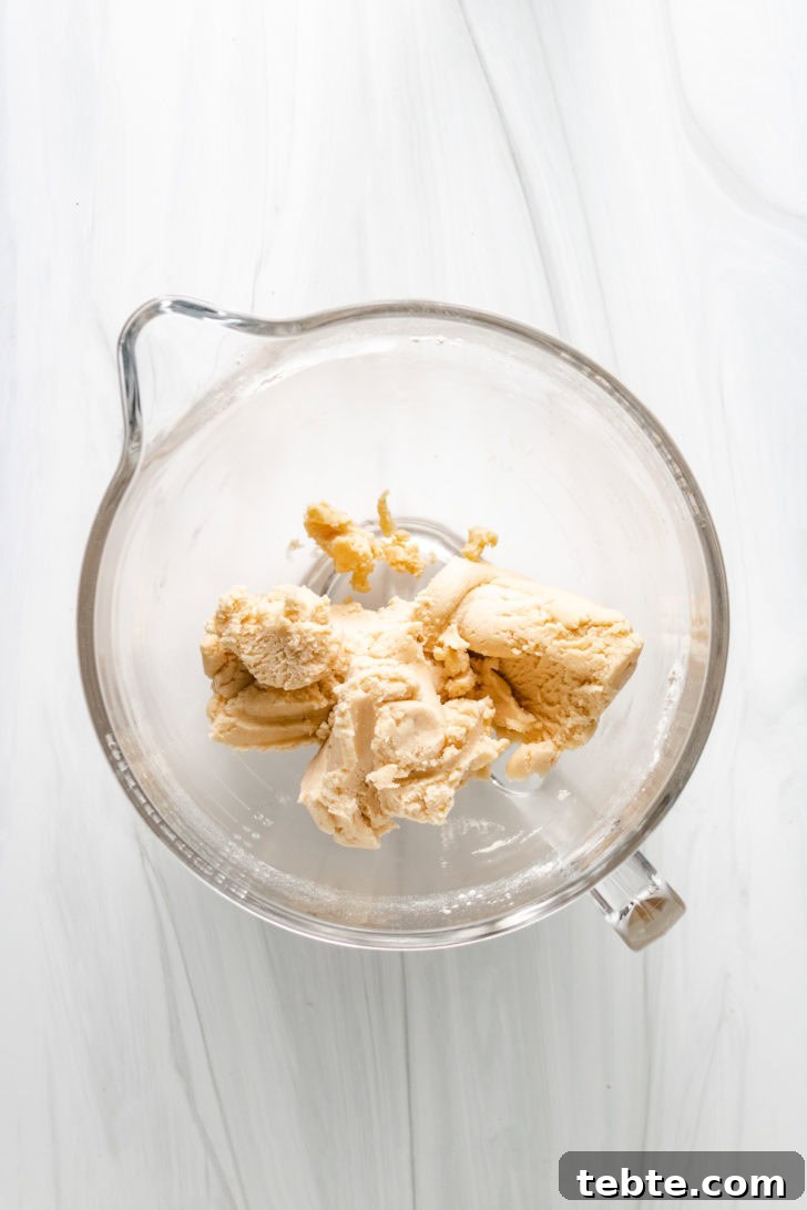 Top down view of shortbread dough in a bowl.