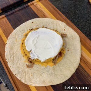 tostada shell topped with sour cream