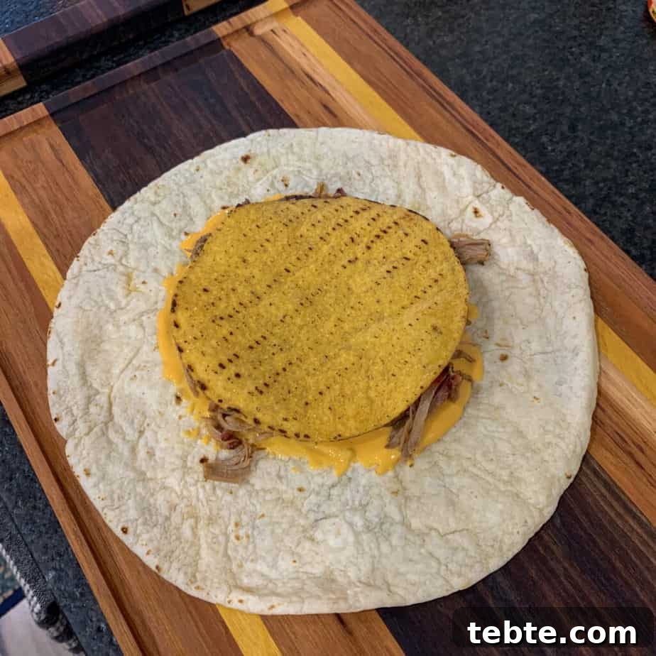 tostada shell over toppings and a tortilla