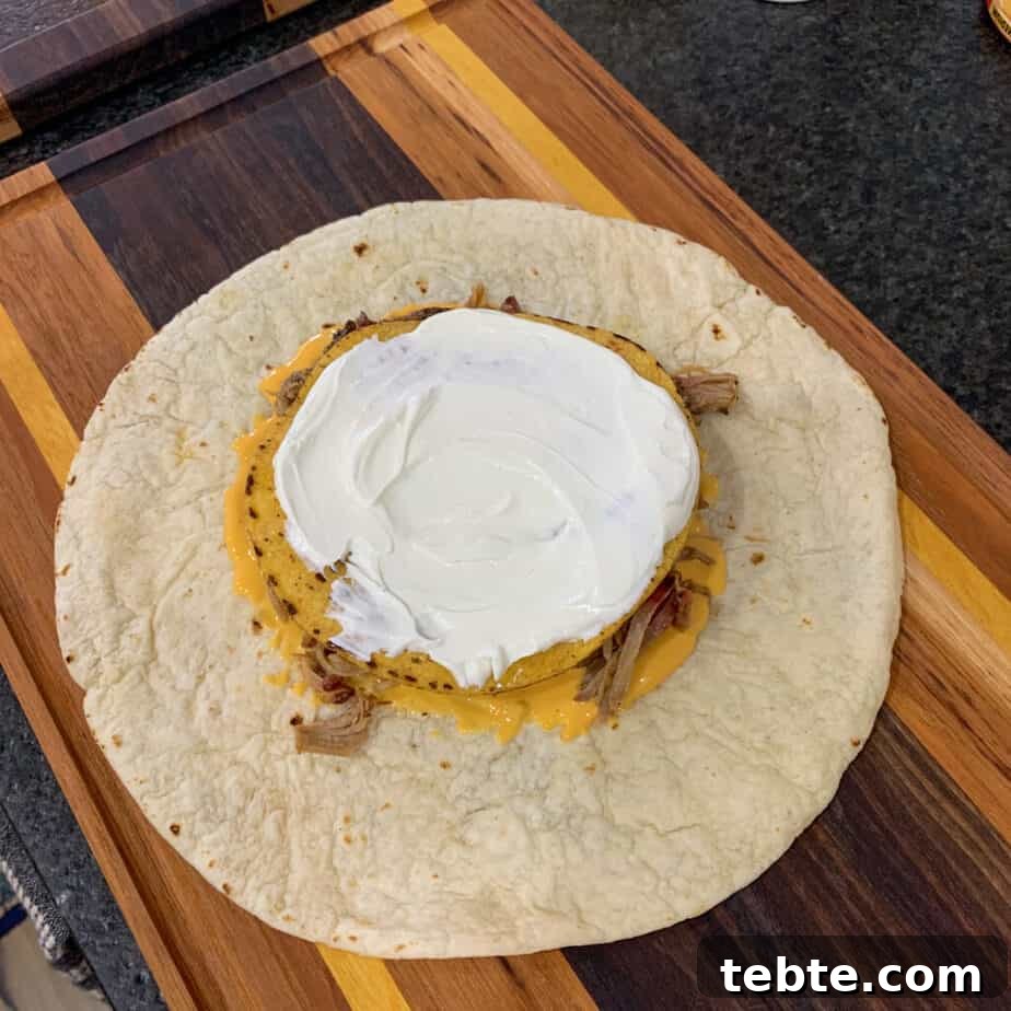 tostada shell topped with sour cream