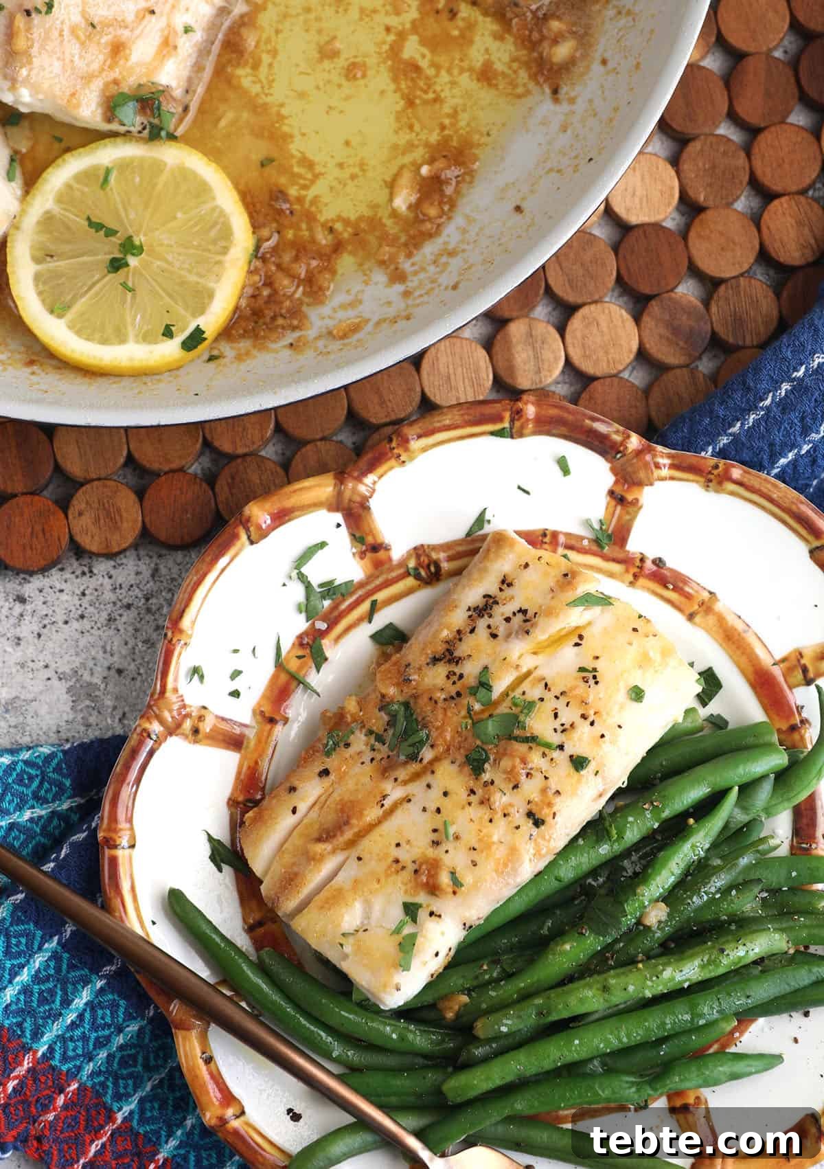 Miso Garlic Butter Mahi Mahi Recipe with Lemon and Herbs 8 Overhead view of mahi mahi fillet on plate with green beans