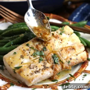 Miso Garlic Butter Mahi Mahi Recipe with Lemon and Herbs 10 Drizzling miso garlic butter sauce onto mahi mahi fillet
