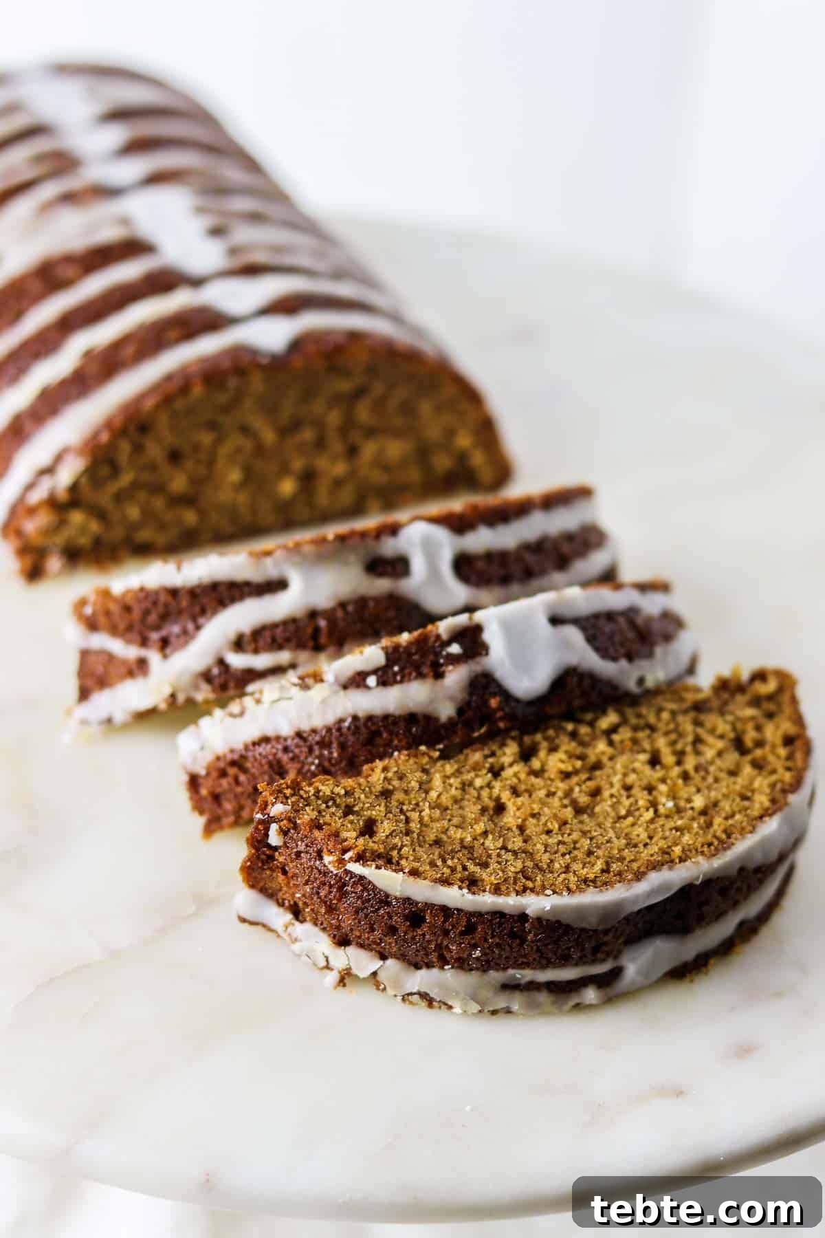 Sliced Swedish Spice Cake on a marble surface.