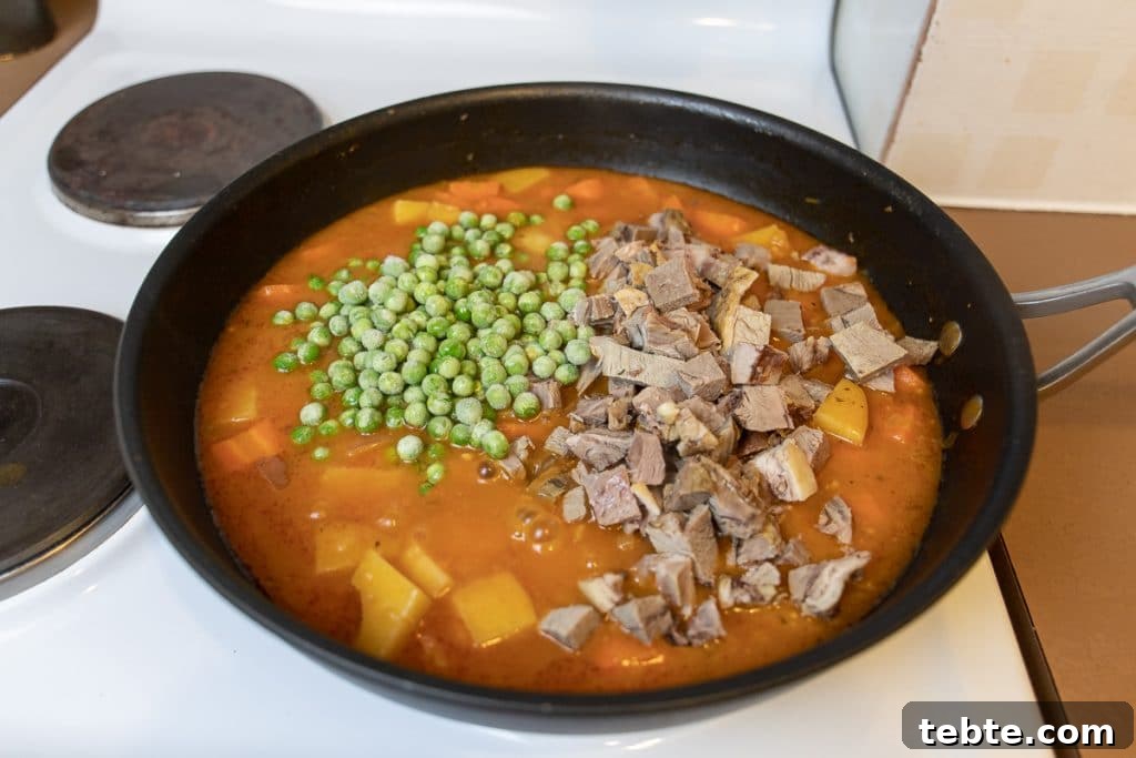 Leftover Roast Lamb Stew Recipe for Tender, Flavorful Meals 8 add lamb and peas