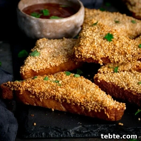 Chinese-Style Beef Curry Recipe: Savory Stir-Fry with Aromatics 11 Prawn toast on a black serving board