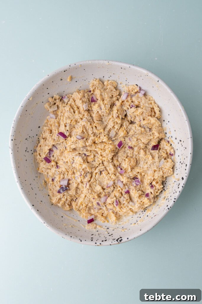 10-Minute Chickpea Salad Wrap Recipe for Quick Lunch 5 Chickpea salad made with smashed garbanzo beans, mayonnaise, diced red onion, salt, pepper, and oregano.