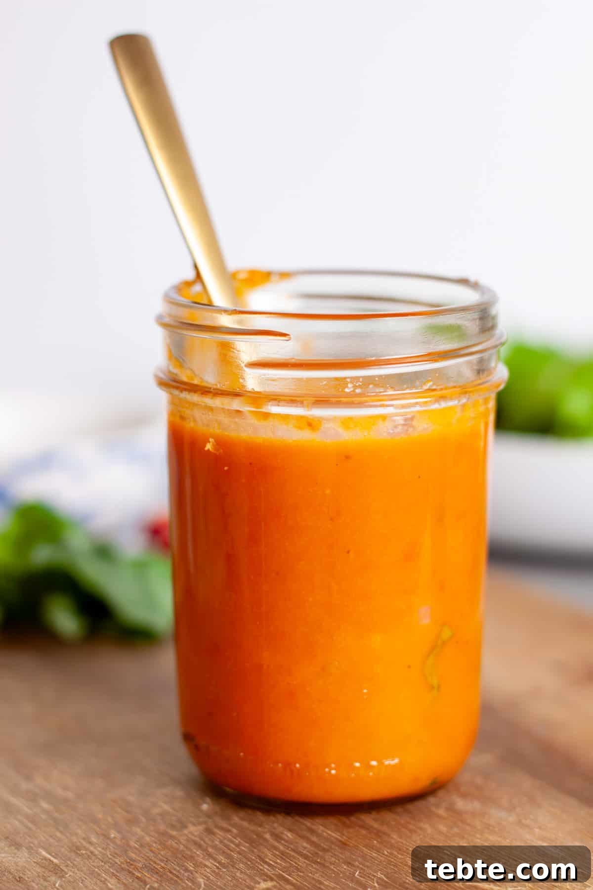 Sun-Dried Tomato Vinaigrette Recipe for Bright, Tangy Salads 9 A mason jar with a vibrant red sun-dried tomato vinaigrette.