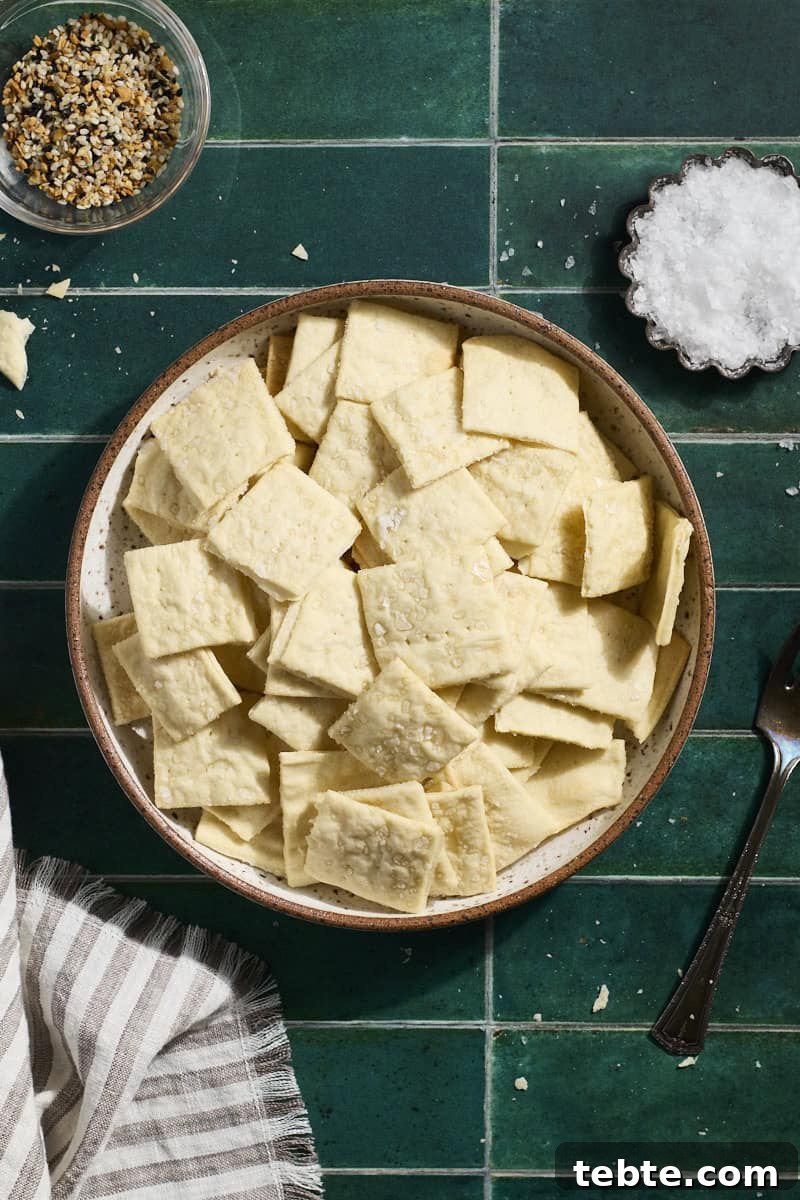 Crispy Sourdough Discard Crackers: Crunchy Homemade Recipe 2 Sourdough Discard Crackers in a bowl.