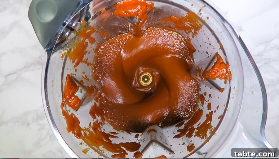 Chile Colorado Beef Stew in Rich Red Chile Sauce 7 red chile sauce being blended in a vitamix