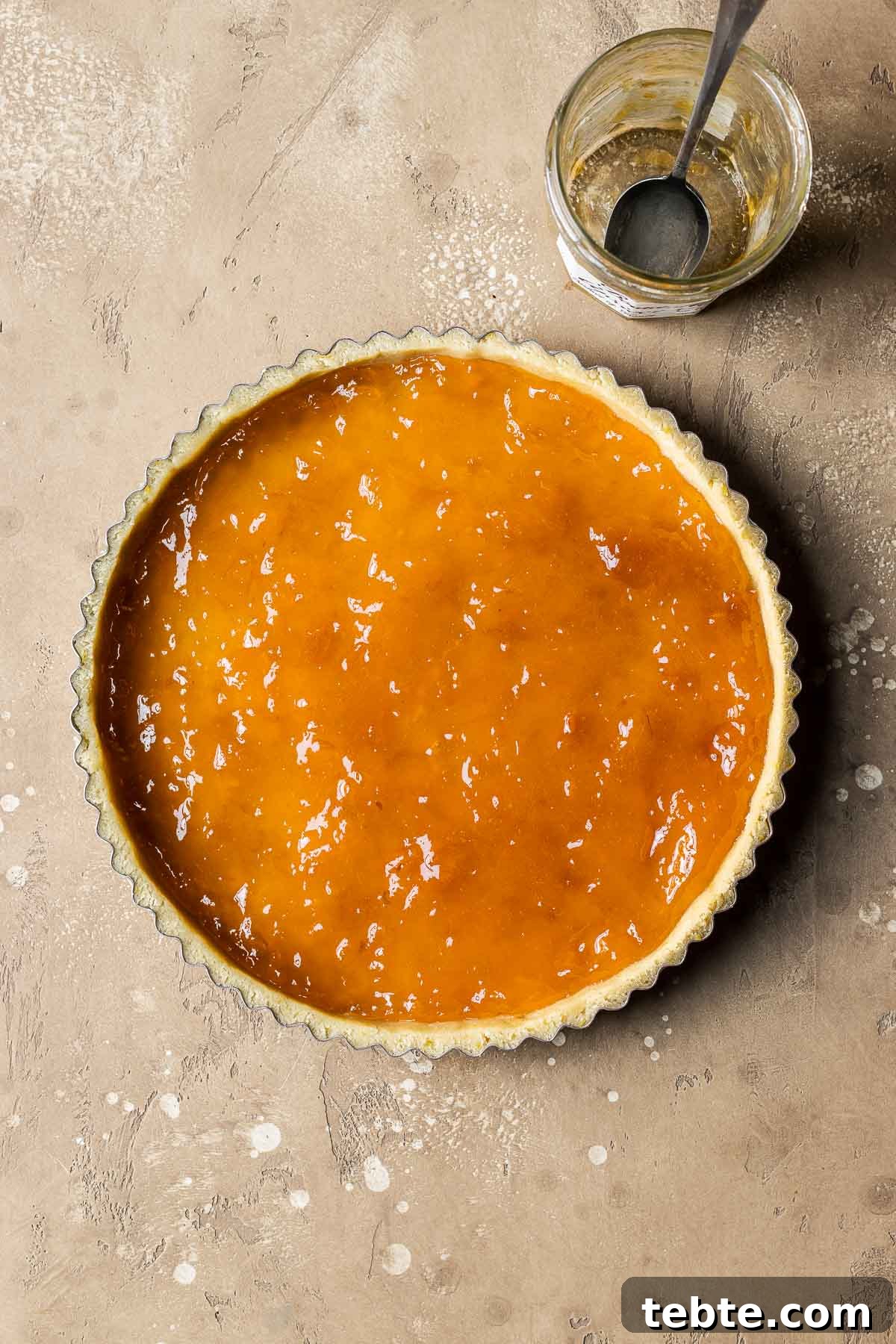 Classic Italian Jam Tart (Crostata) Recipe 11 An unbaked tart shell filled with apricot jam.