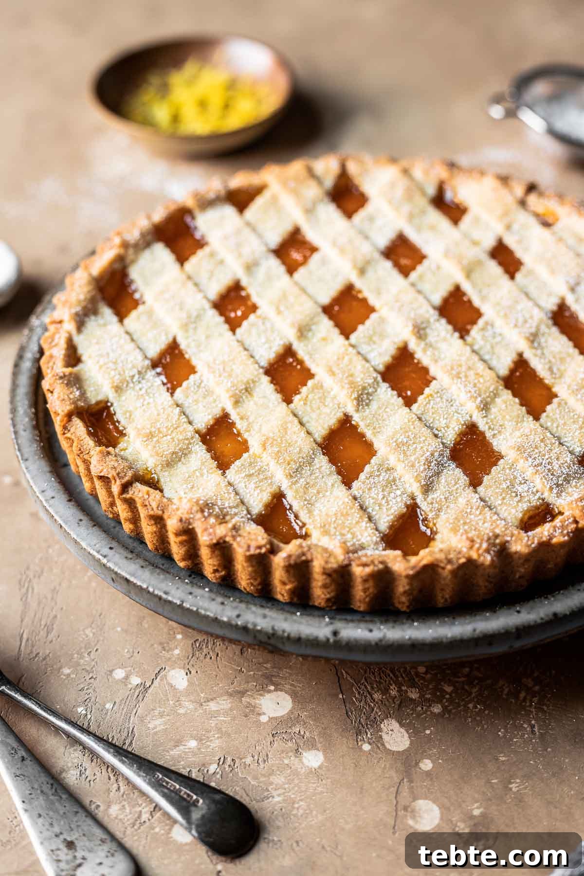 Classic Italian Jam Tart (Crostata) Recipe 13 A lattice topped crostata di marmellata on a plate.