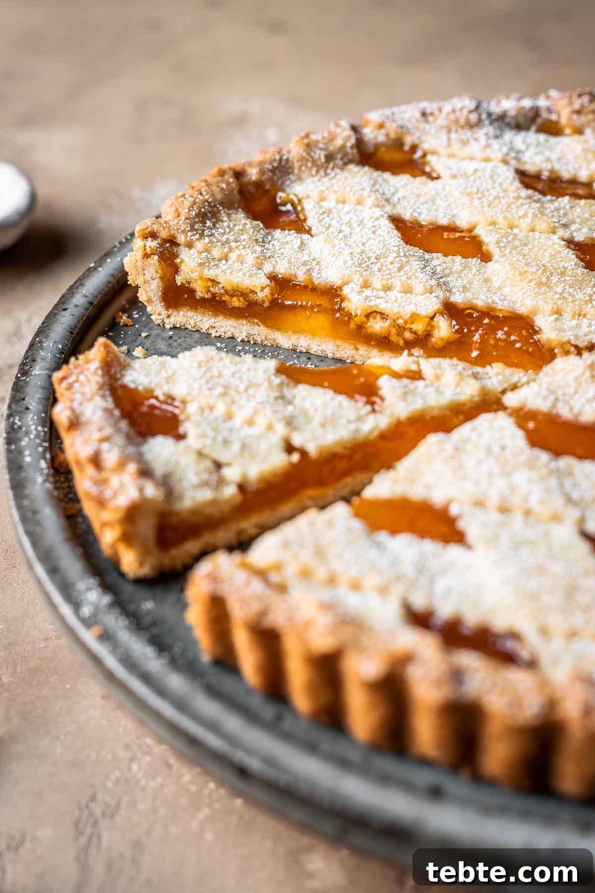 Classic Italian Jam Tart (Crostata) Recipe 14 Sliced apricot jam tart.