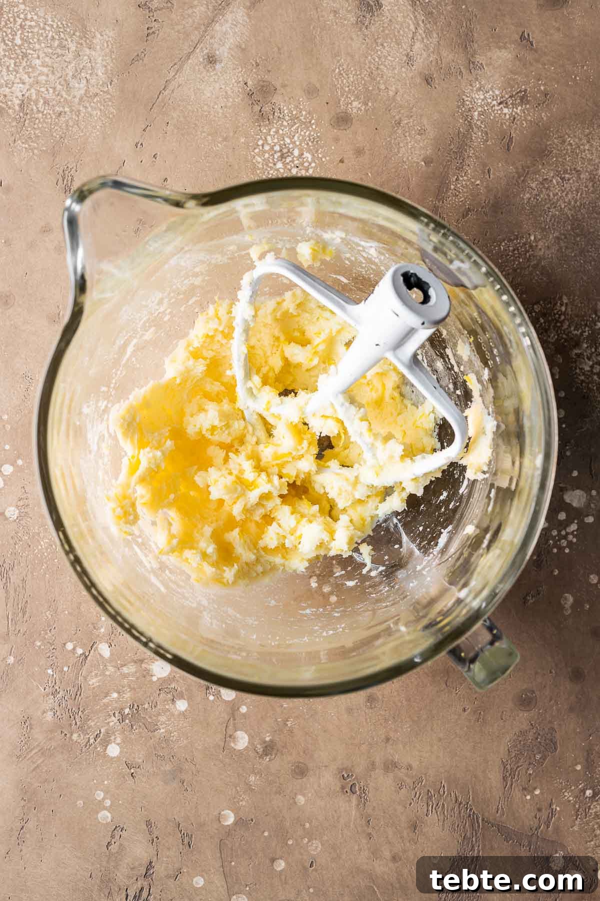 Classic Italian Jam Tart (Crostata) Recipe 4 Wet ingredients for pastry dough in a clear glass mixing bowl.