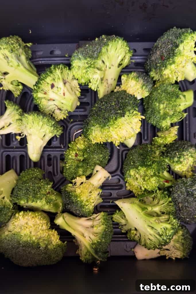 Crispy Air Fryer Broccoli Recipe in Minutes 5 air fryer broccoli in air fryer basket