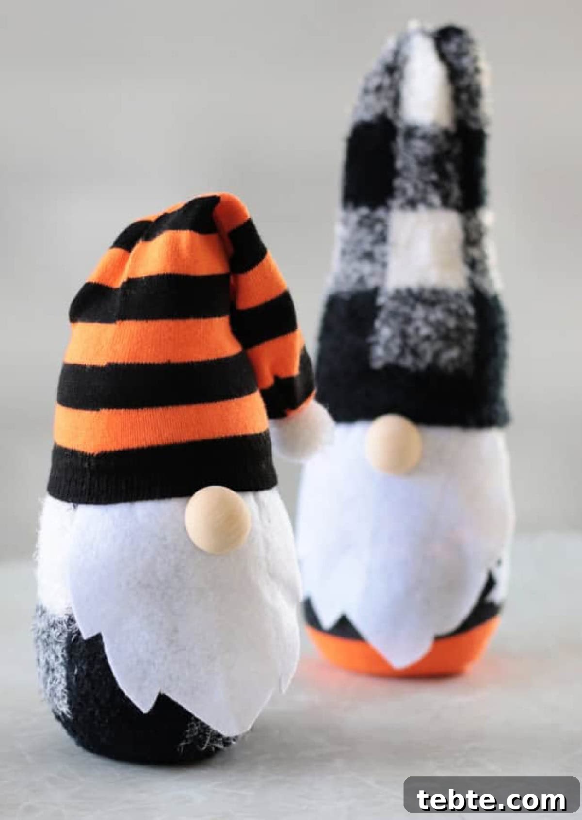 No-Sew Halloween Gnomes Made from Socks 2 Two sock gnomes on a table.