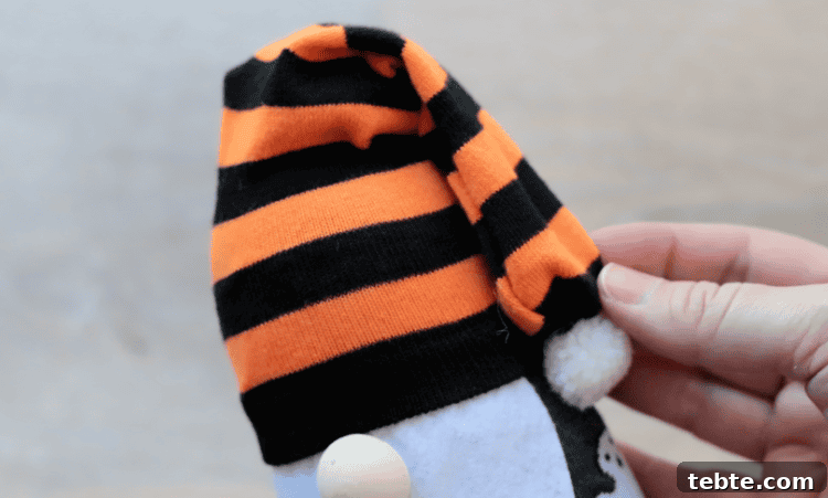 No-Sew Halloween Gnomes Made from Socks 14 Striped sock on top of gnome.