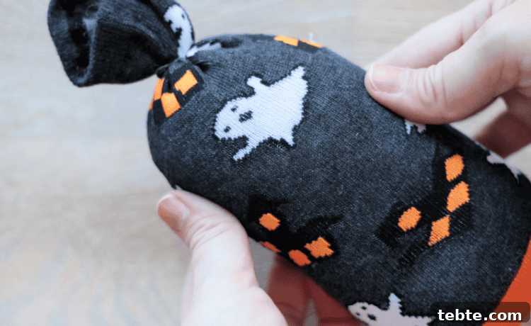 No-Sew Halloween Gnomes Made from Socks 7 Halloween sock stuffed with rice and pillow stuffing.