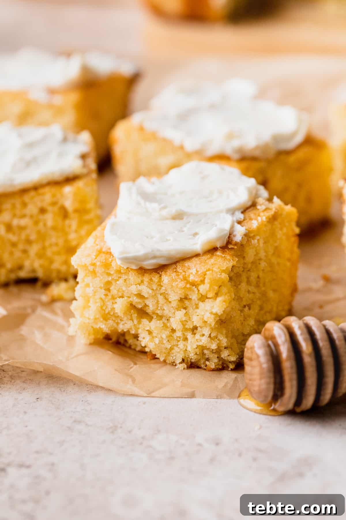 Honey Butter Cornbread Recipe: Sweet, Buttery Southern Cornbread 2 Honey butter cornbread with butter on top.