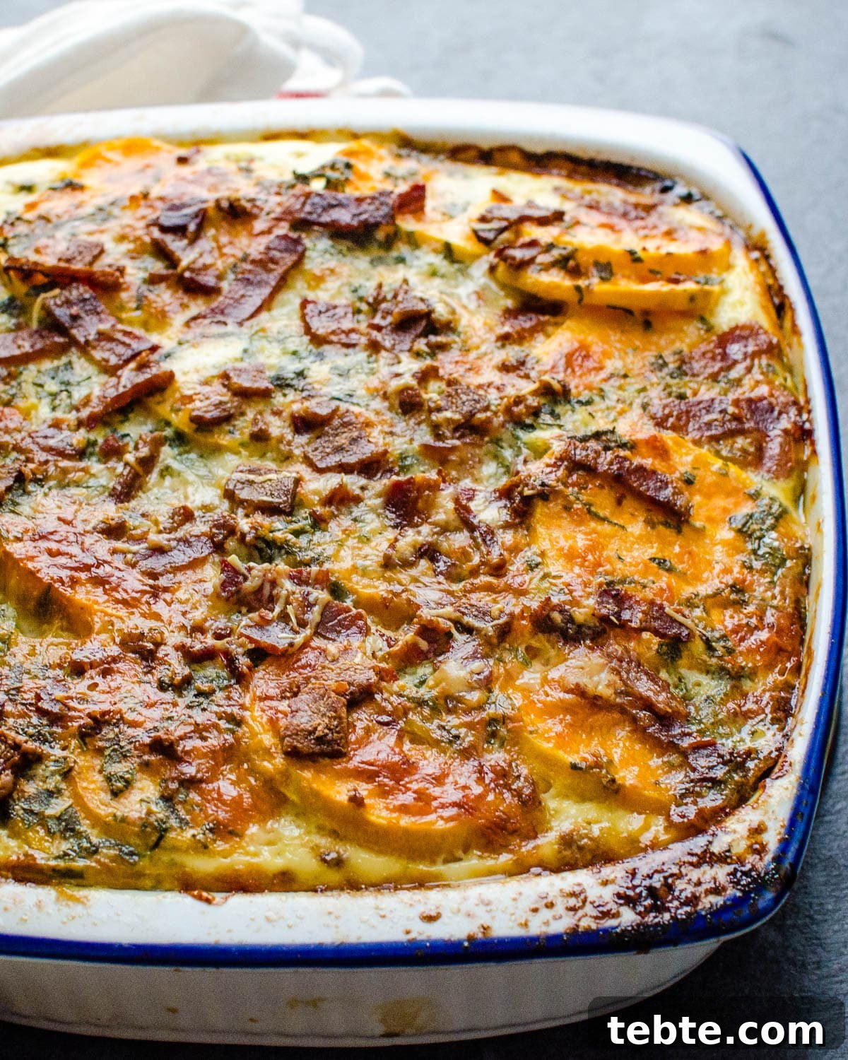 Savory Sweet Potato Casserole with Herbed Panko Topping 7 The baked sweet potato casserole with bacon and cheese.