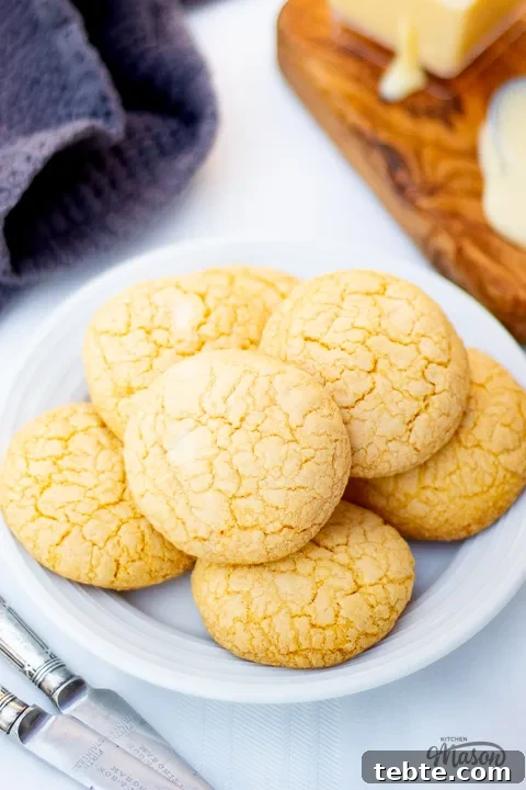 Custard and White Chocolate Cookies Recipe for Crisp, Creamy Treats 2 A plate of custard and white chocolate biscuits on a white table cloth.