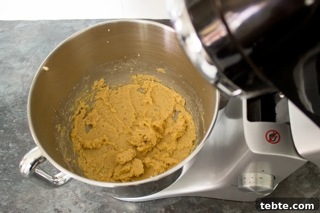 Custard and White Chocolate Cookies Recipe for Crisp, Creamy Treats 15 Butter and sugar creamed together in an electric stand mixer.