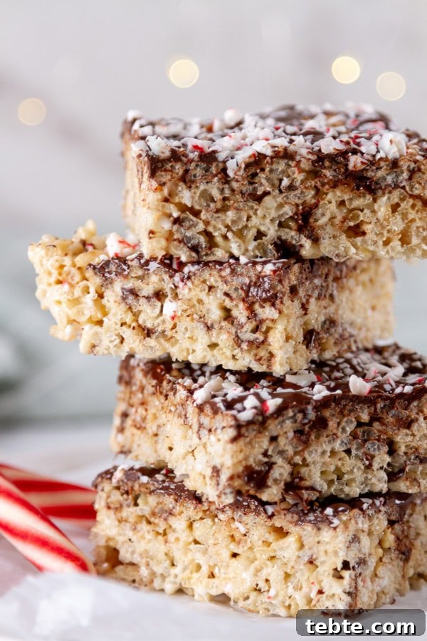 Peppermint Rice Krispies Treats Recipe for Festive Holidays 6 a stack of rice krispies treats with some candy canes.