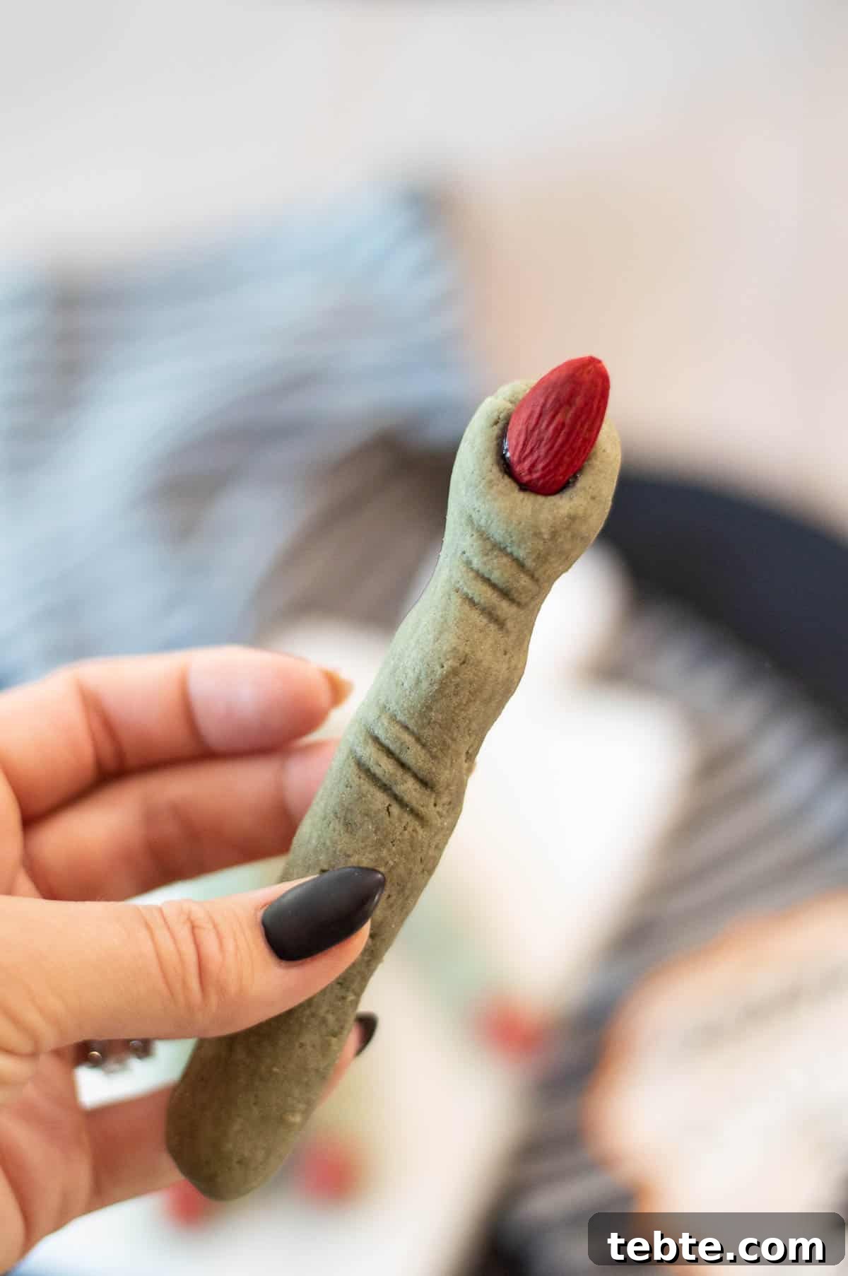 Witch Finger Cookies in a hand