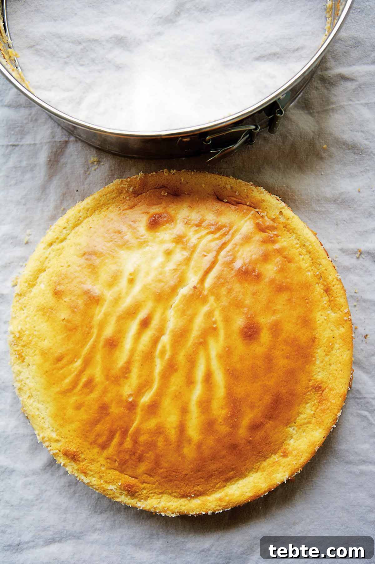 Roman Jewish Quarter Ricotta Cheesecake Recipe — Classic Torta di Ricotta 2 A ricotta cheesecake on a piece of parchment.