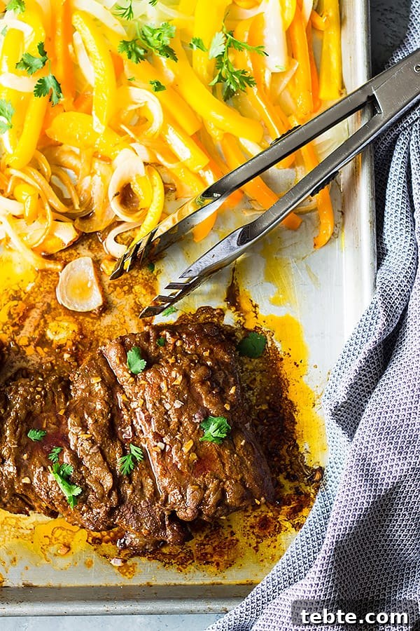 Sheet Pan Steak Fajitas Recipe for Quick Weeknight Dinner 3 Sheet Pan Steak Fajitas with peppers and onions