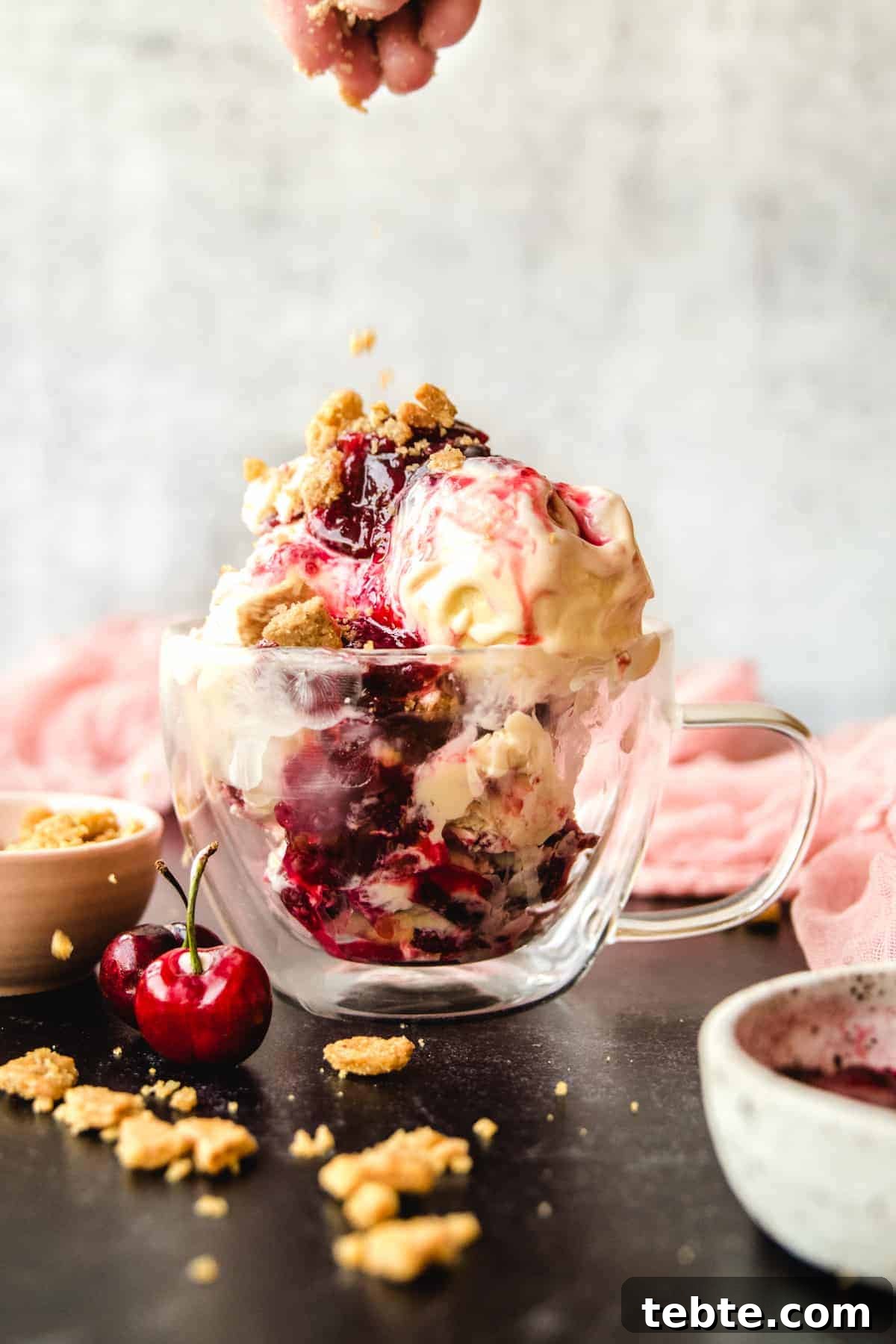 The crunchy graham cracker crumble adds a nice crunch to this bourbon cherry cheesecake ice cream sundae.