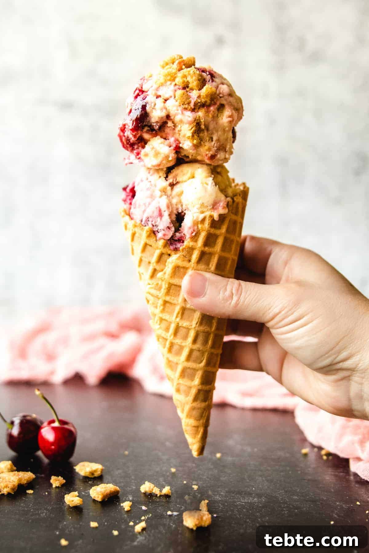 Ice cream cones full of delicious bourbon cherry cheesecake ice cream will be a hit at your summer gatherings!