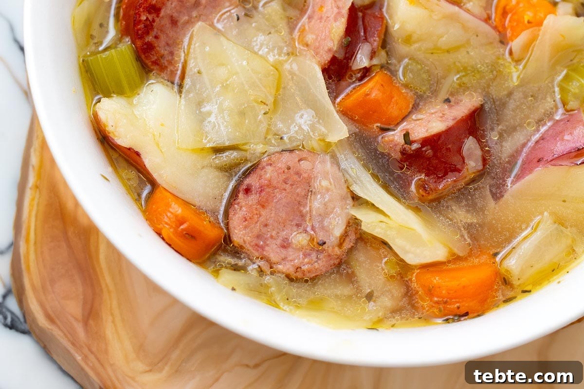 Instant Pot Kielbasa, Cabbage & Potato Soup Recipe 3 Instant Pot Kielbasa Cabbage Potato Soup in white bowl