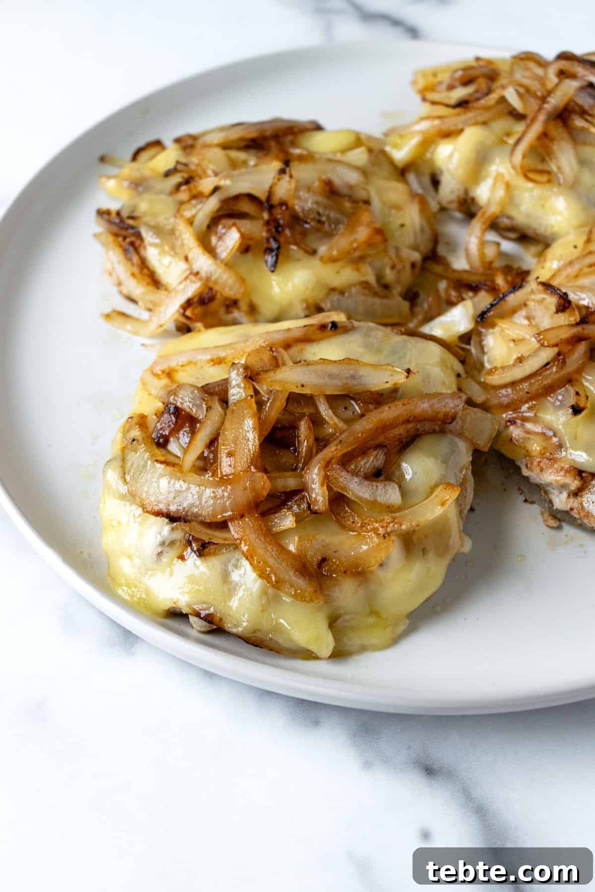 Juicy Turkey Smash Burgers with Crispy Edges and Melty Cheese 8 Turkey Smash Burgers with Cheese and Sautéed Onions.