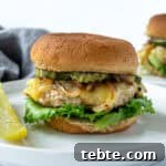 Turkey Smash Burgers on buns with onions, pickles, and cheese.