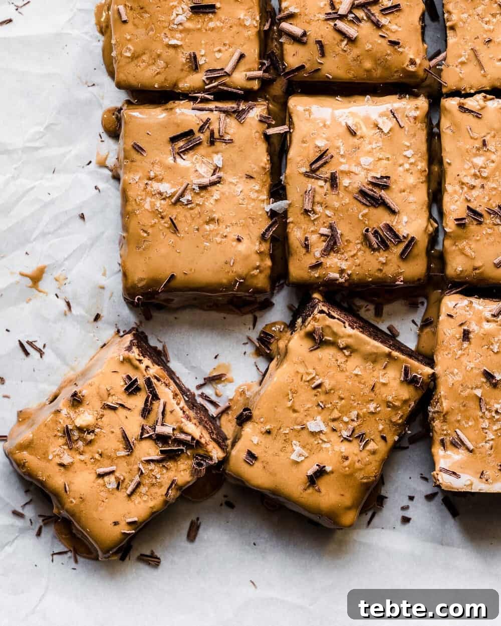 Vegan Gingerbread Brownies with Espresso Glaze Recipe 7 Gingerbread brownies on parchment paper.